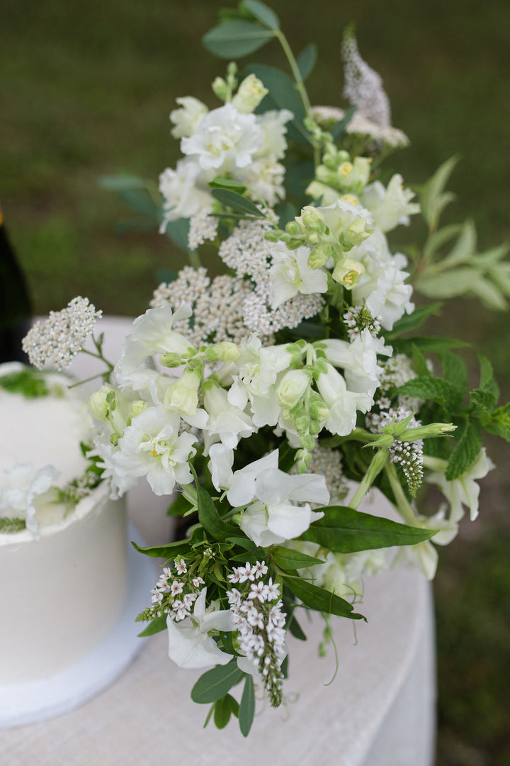 A bouquet of white and off-white flowers.