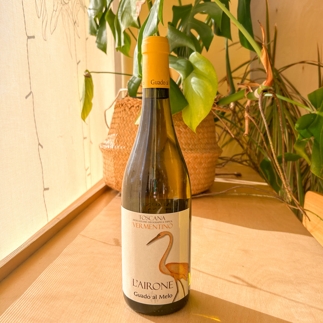 A bottle of white wine. The label reads: "Toscana Vermentino. L&