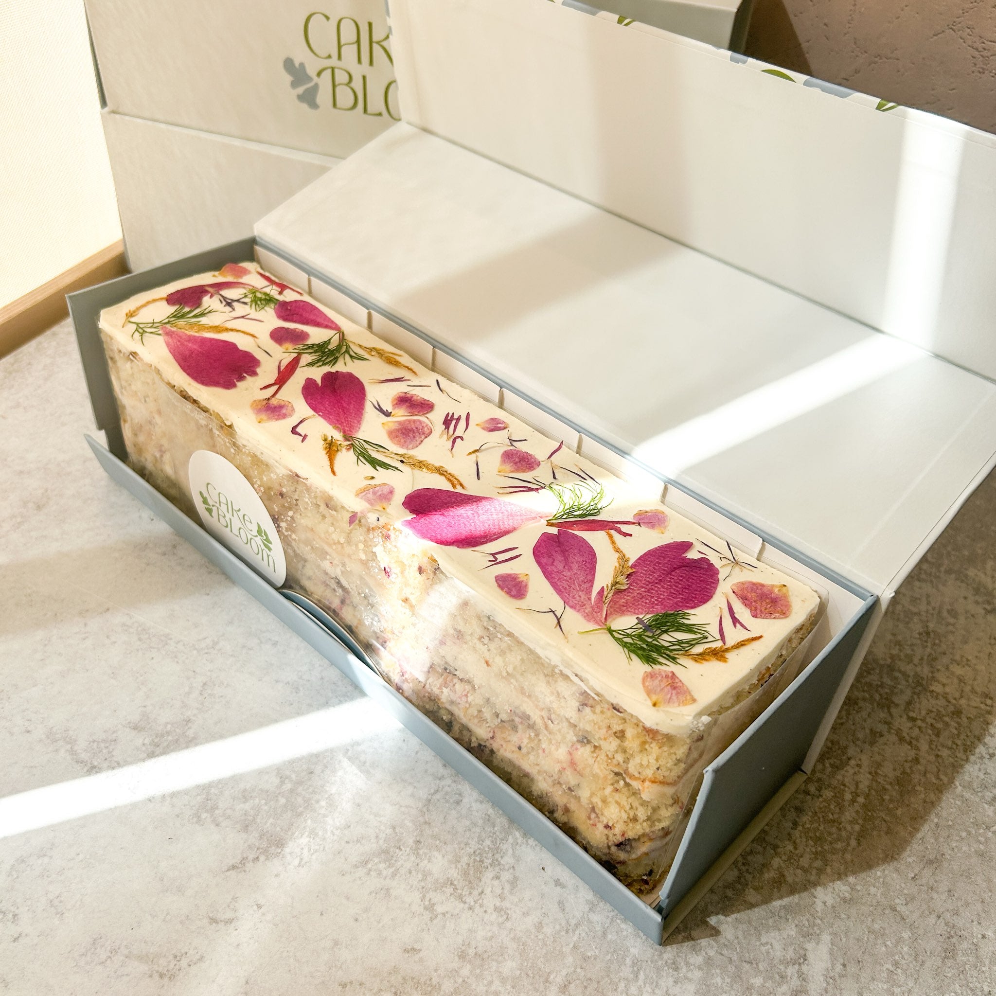 The Longboard Shipper – Cake Bloom