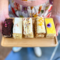 Cake Bloom's 5-slice signature sampler box is a favorite for new customers to explore our offerings. Available for pick-up or delivery in Charlottesville, Virginia.