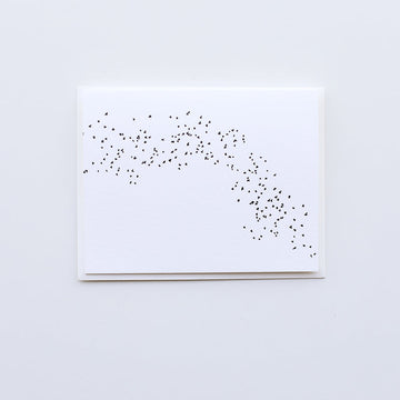 A white card depicting a "murmuration," or a flock or starlings making a synchronized pattern whilst in flight. The card comes with a white envelope.