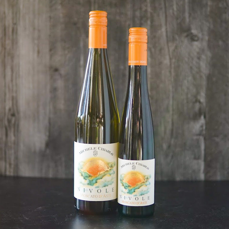 Two orange-capped bottles, one large and one small, of Nivole Moscato. 