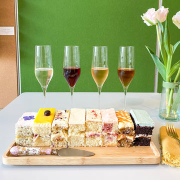 Cake Bloom's Ultimate Cake and Champagne Pairing Experience features eight slices of cake paired with a flight of four 2-ounce pours of wine ranging from brut sparkling to a still Moscato. Cake and Champagne pairing available exclusively at Cake Bloom in Charlottesville, Virginia.
